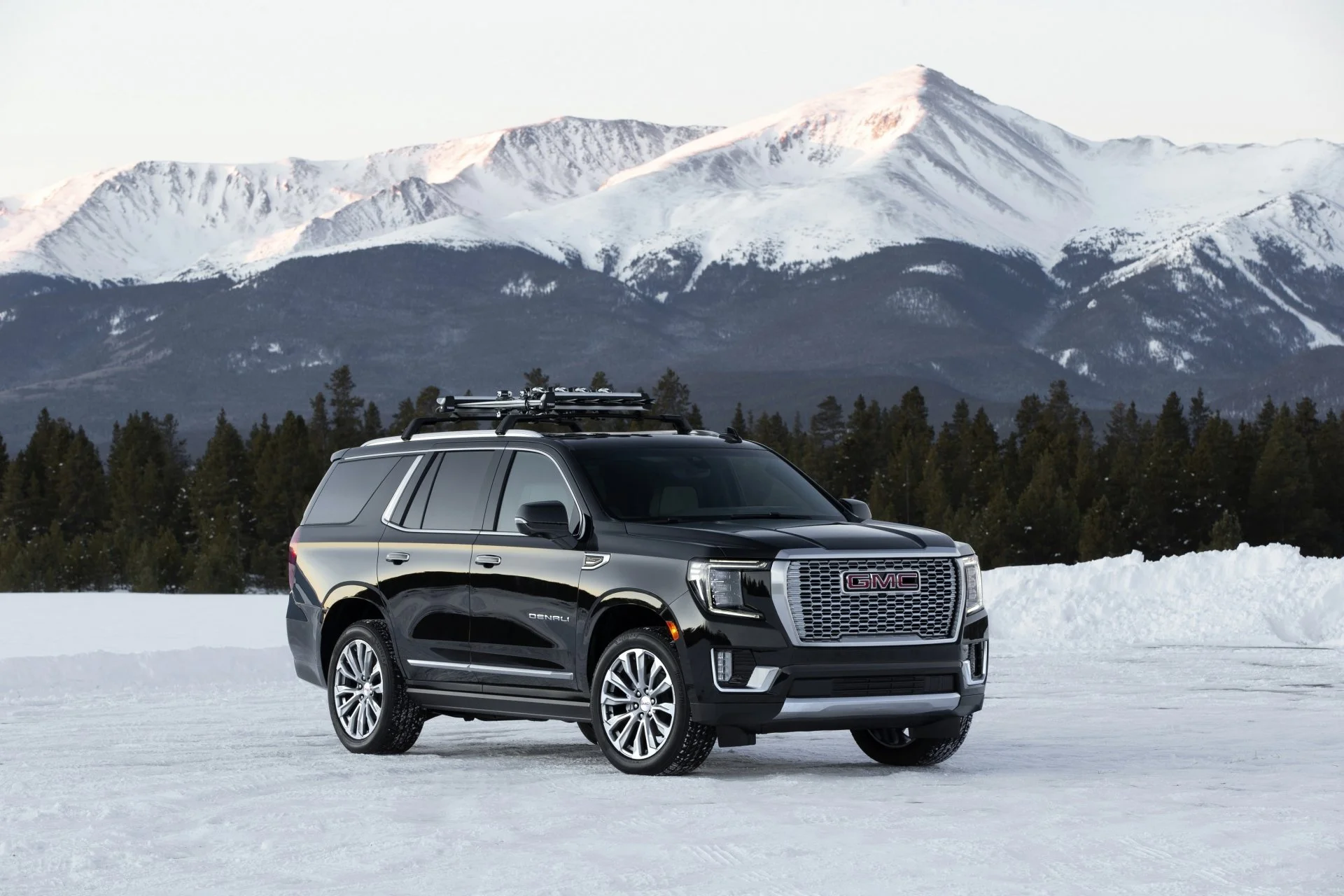 Mayflower Boulder chauffeur service SUV with Colorado Rocky Mountains in background Boulder limo service